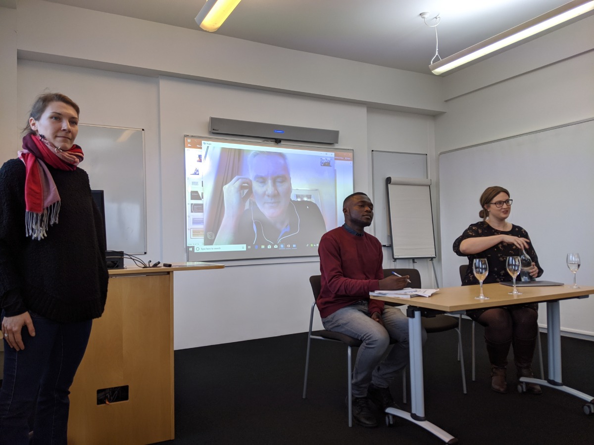 "Three people conduct a presentation"